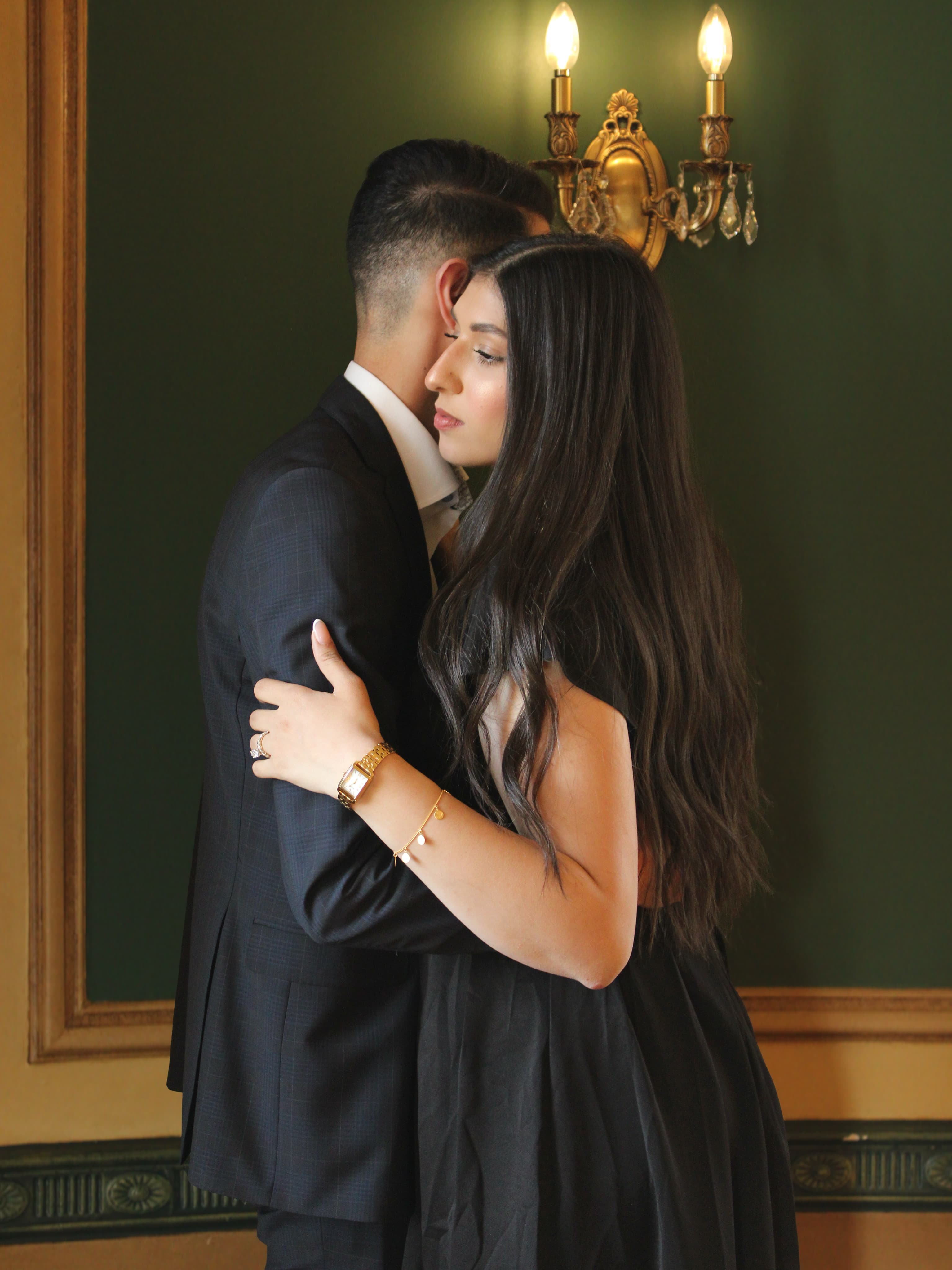 Couple embracing indoors, photographed by ShuhraBilNoor